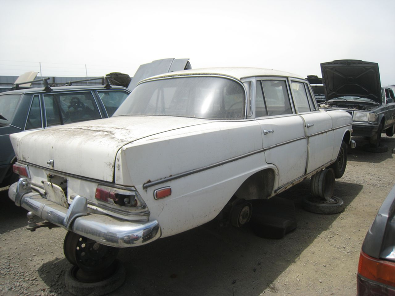 Illustration for article titled Happy Tailfins And All, This 1965 Mercedes-Benz 190c Is Crusher-Bound